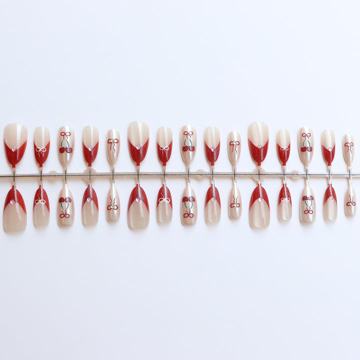 Artistic Press-On Nail Set with Cherry and Ribbon Design Bowlift