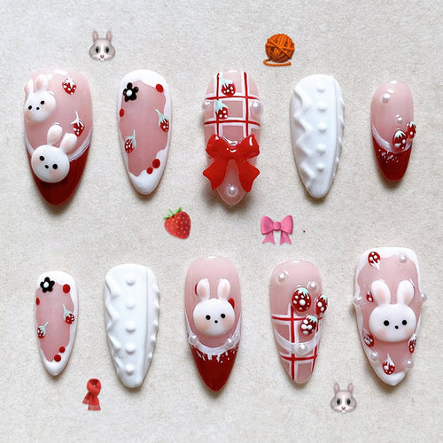 Creative acrylic nail set with playful bunny and gift designs Bowlift