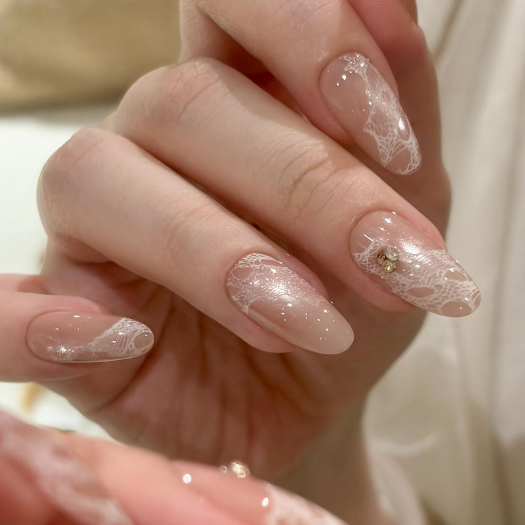 Elegant artificial nails with tips and glitter Bowlift