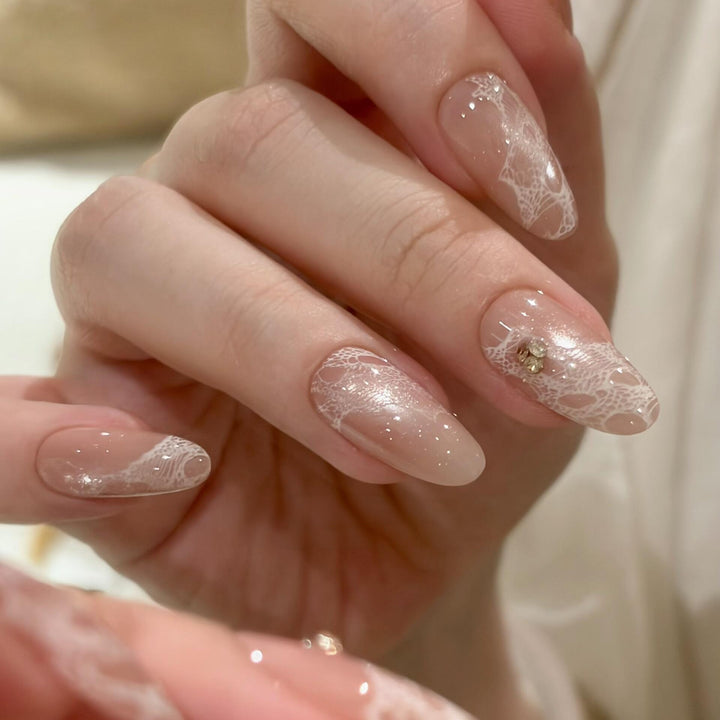 Elegant artificial nails with tips and glitter Bowlift