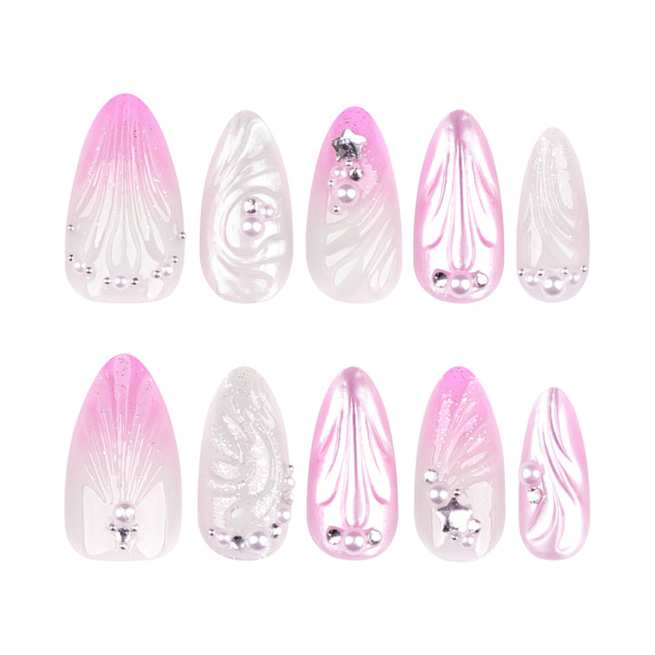 Artificial nail art with elegant swirl design and pearl embellishments Bowlift