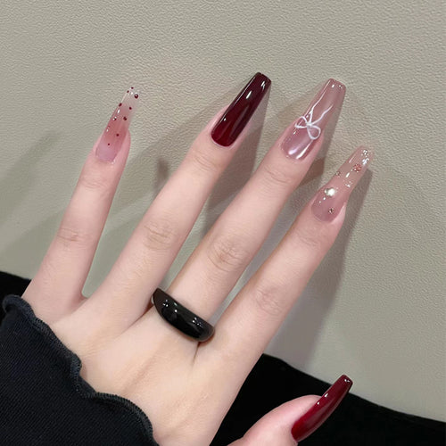 Artistic Long Press-On Nails Set with Glossy and Decorative Accents Bowlift