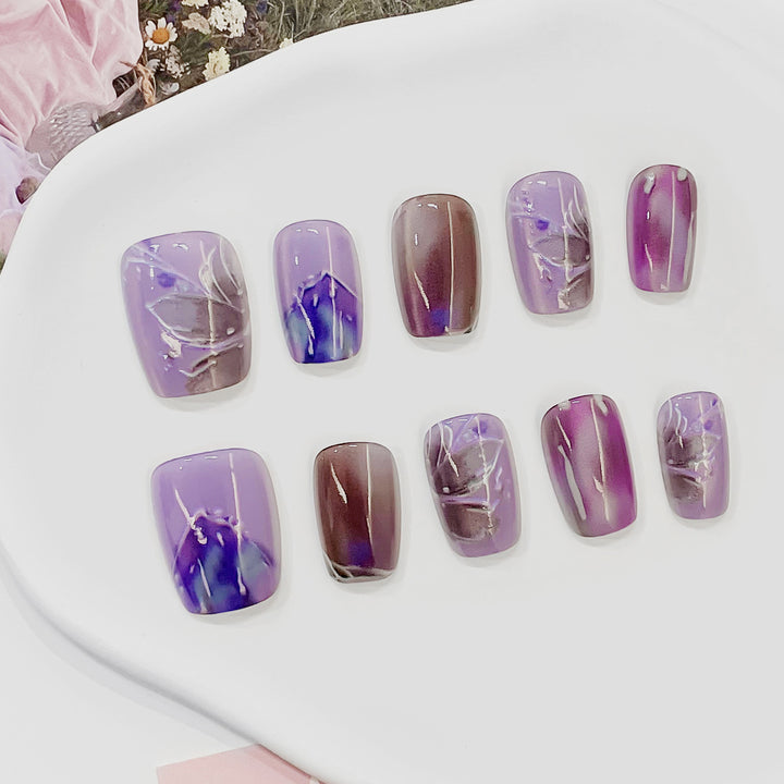 Artful acrylic nails with marbled design Bowlift