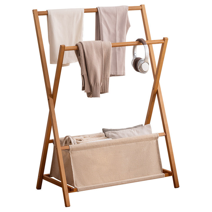 Designer laundry rack with foldable frame and practical shelf Bowlift