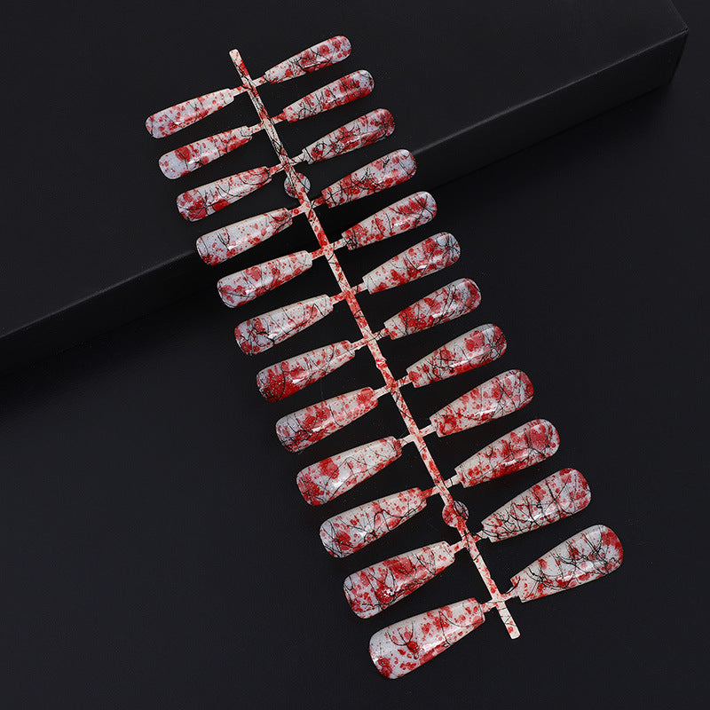Creative nail art with blood splatter design Bowlift
