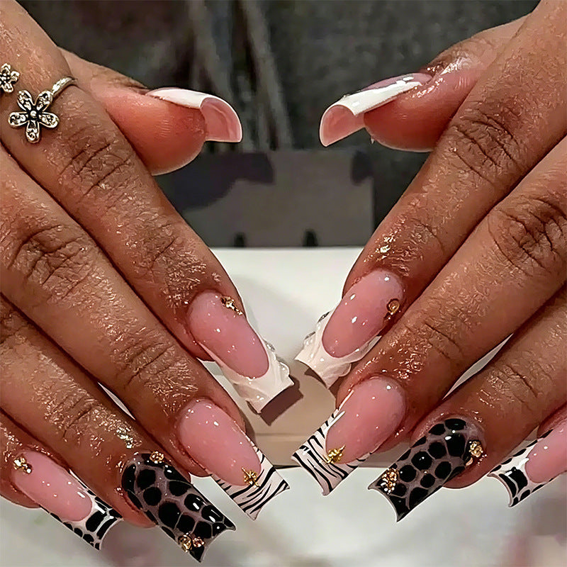 Exclusive artificial nails with elegant animal design and glitter accents Bowlift