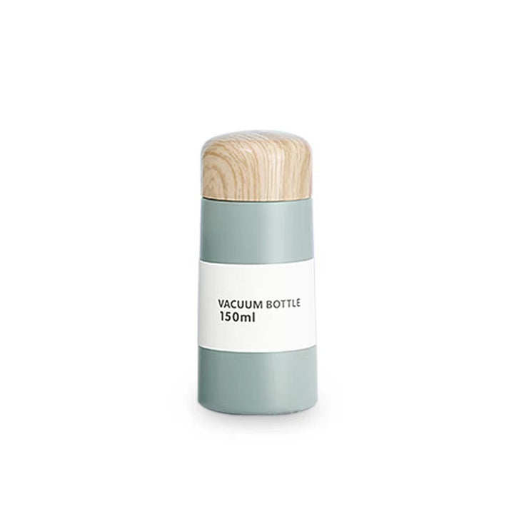 Women vacuum-insulated water bottle with innovative wooden lid Bowlift