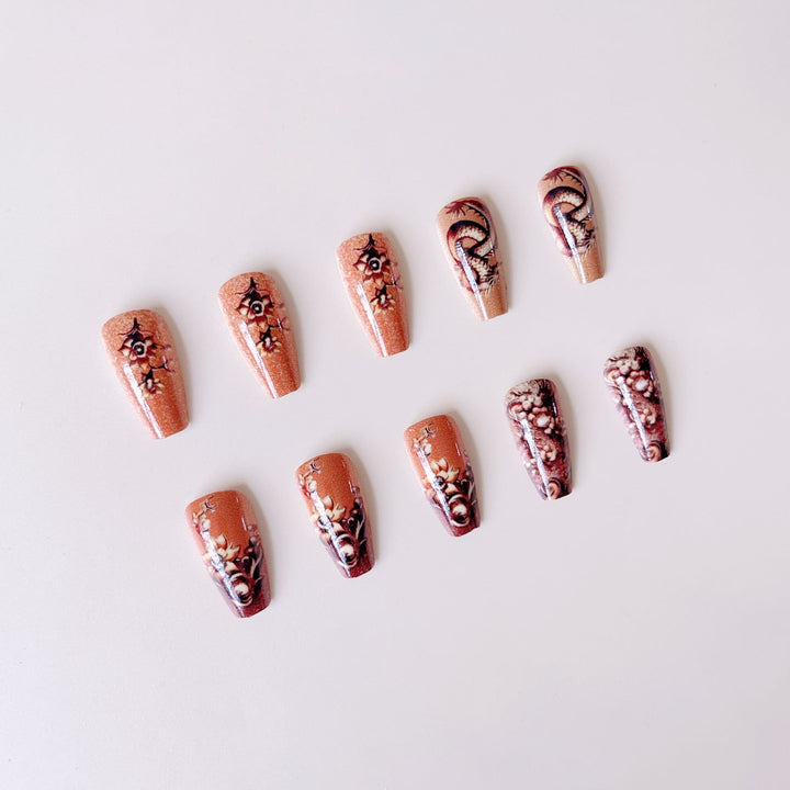 Elegant artificial nail set with 3D dragon designs and gold accents Bowlift