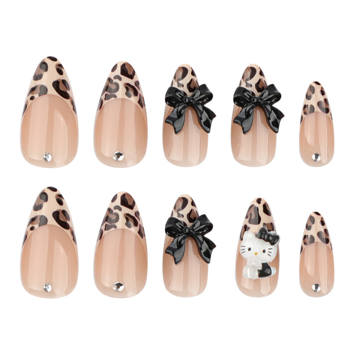 Artistic extension nails in leopard pattern with bow accents Bowlift