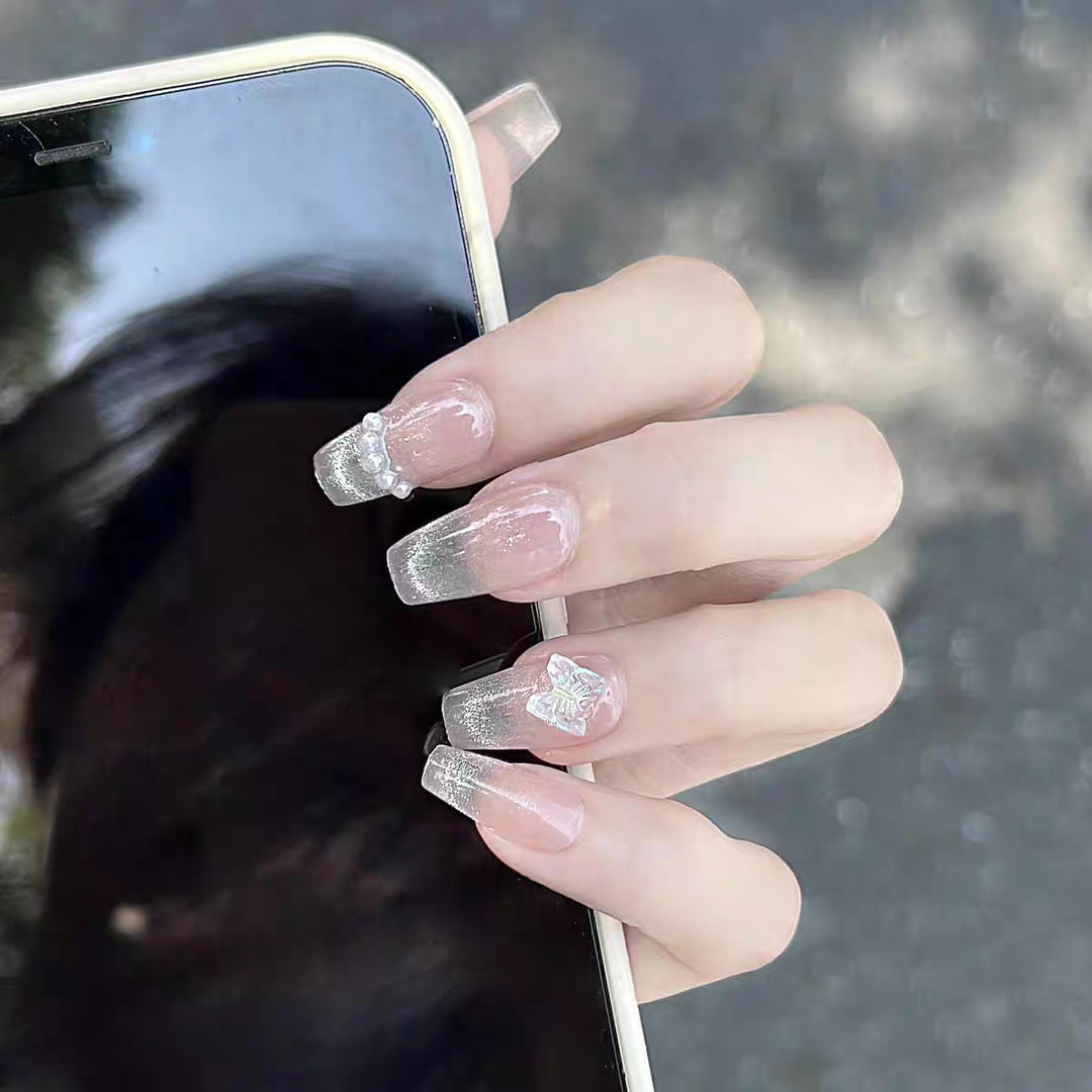 Artistic Press-On Nail Design with Decorative Silver Accents Bowlift