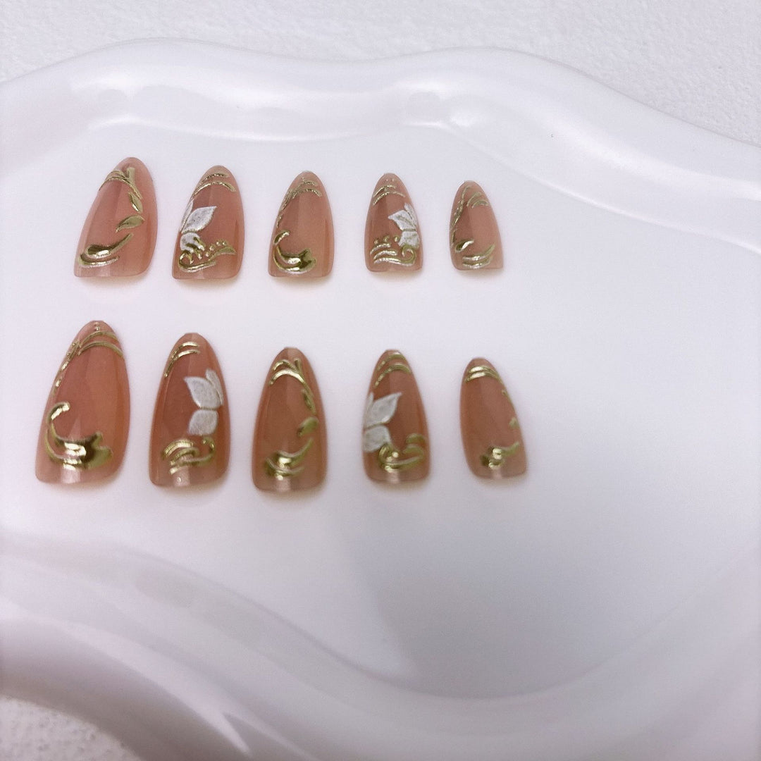 Elegant artificial nails with marble and gold accents Bowlift