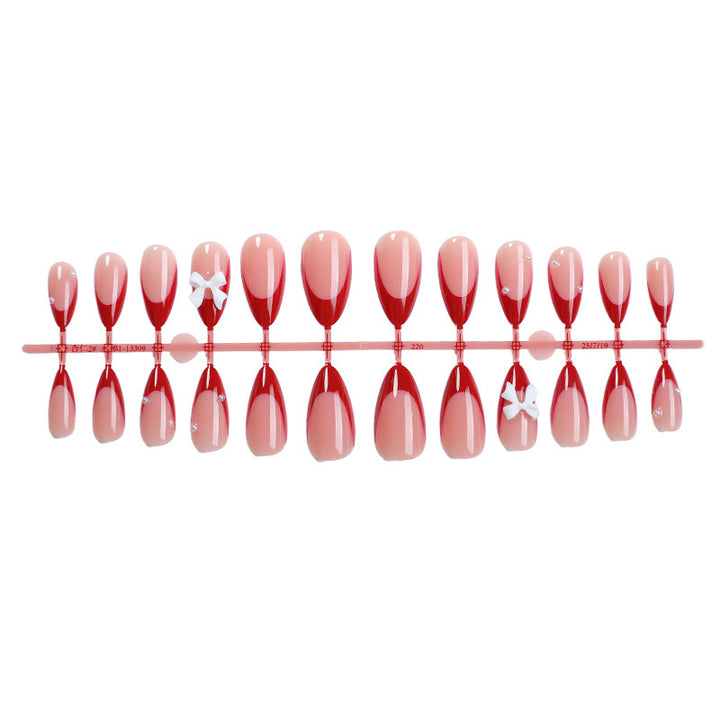 Artificial nail set with elegant bows and glitter accents Bowlift
