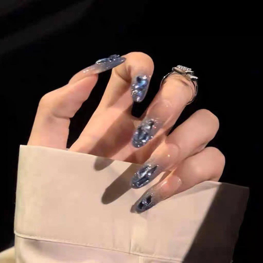 Artificial nails in creative moon and star design Bowlift