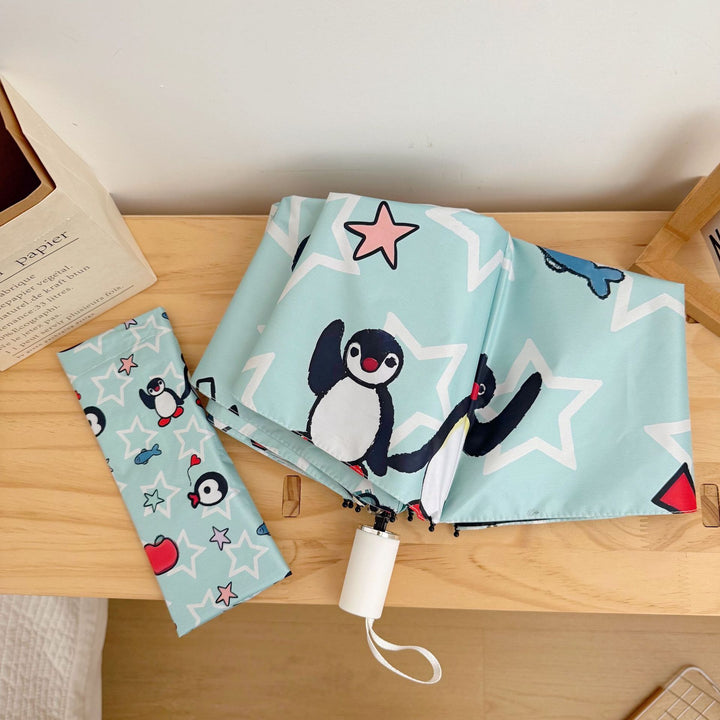 Ladies collapsible umbrella with playful penguin design Bowlift