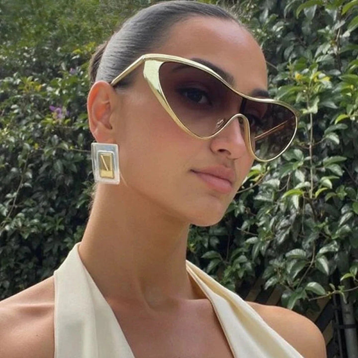 Ladies extravagant shaped sunglasses with protective UV filter Bowlift