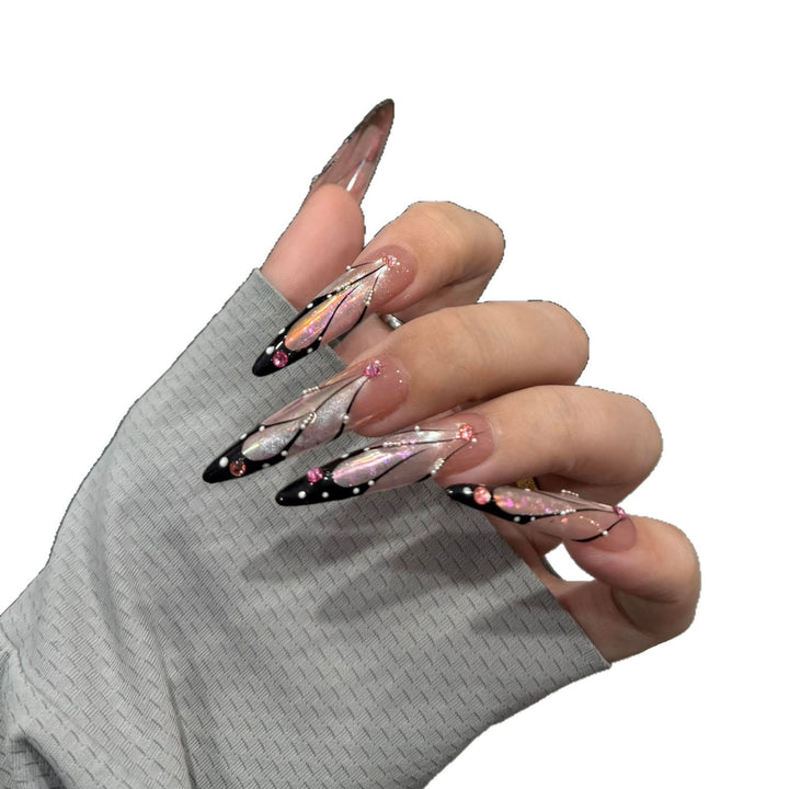 Artifical nail tips with elegant designs and glitter accents Bowlift