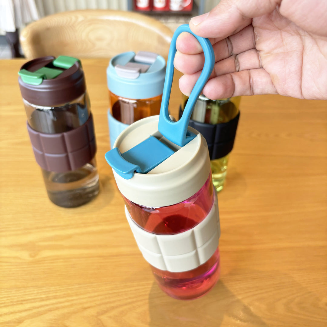 Women's transparent drinking bottle with non-slip silicone coating Bowlift