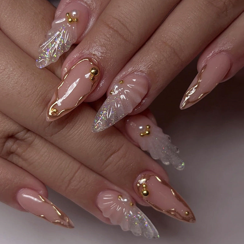 Artful stiletto nails with elegant gold embellishment design Bowlift