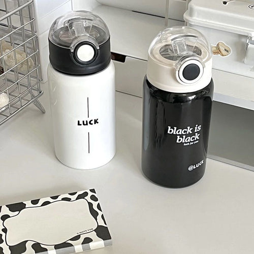 Women's insulated drinking bottle with innovative flip lid and practical handle Bowlift