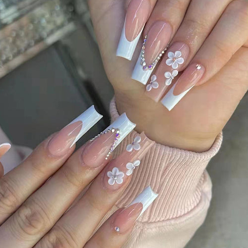 Artificial nail set with romantic floral decorations and glitter accents Bowlift