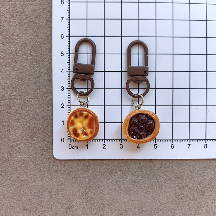 Keychain with cute cake design Bowlift