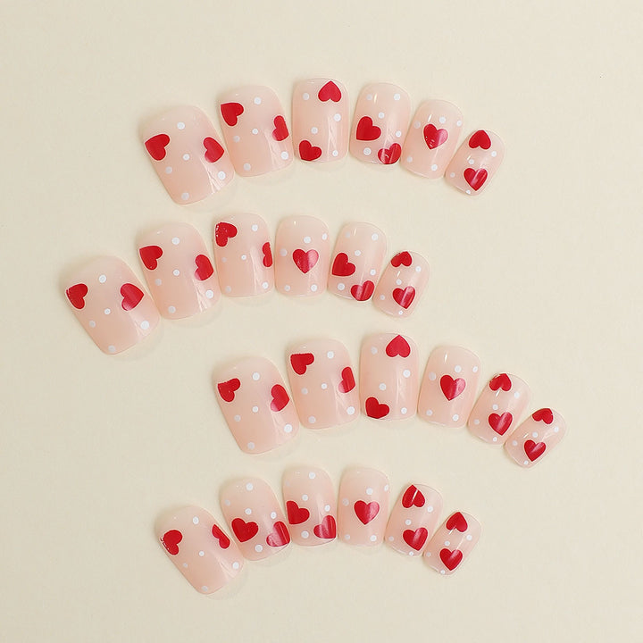 Artificial nail set with romantic heart motifs and shimmering accents Bowlift