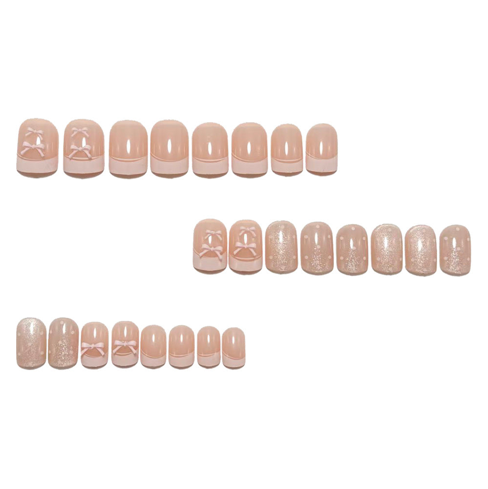 Artificial nails with delicate bows and glitter accents Bowlift