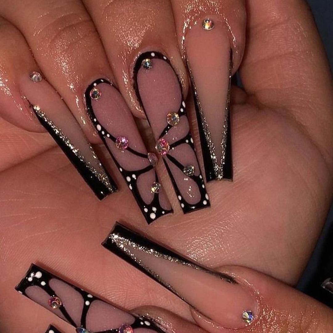 Artful stiletto artificial nails with glitter and butterfly motif Bowlift