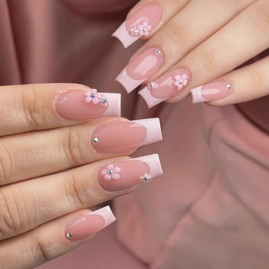 Artificial nail set with elegant 3D flowers and glamorous rhinestone accents Bowlift