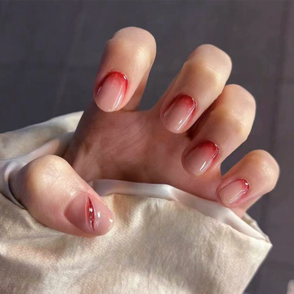 Creative Stiletto Nail Art with Blood Red Accents Bowlift