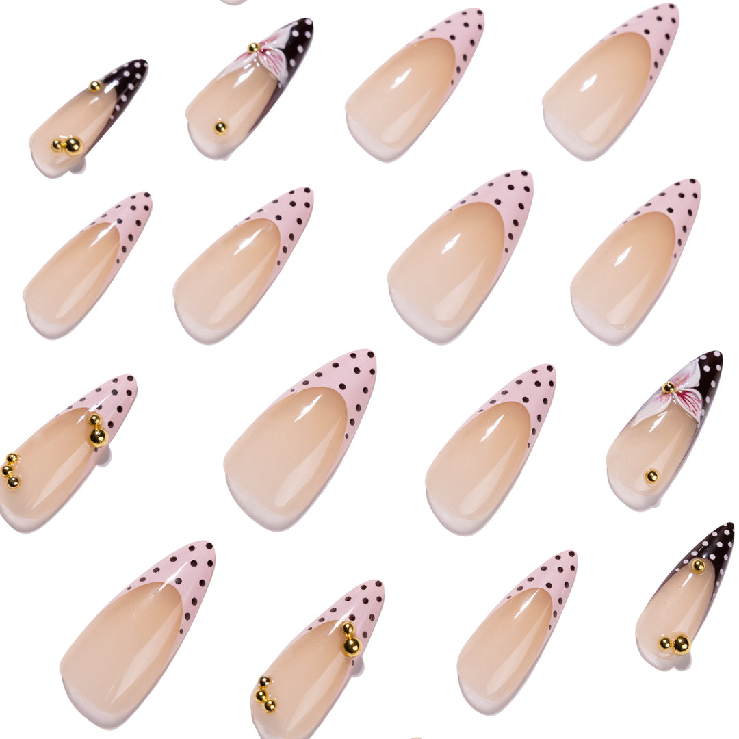 Artful stiletto nails with floral accents and glitter Bowlift
