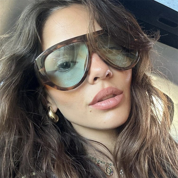 Ladies fashionable sunglasses in modern design with wide frame Bowlift