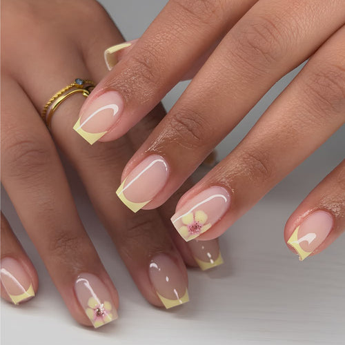 Artistic French-tip nails with floral decorations Bowlift