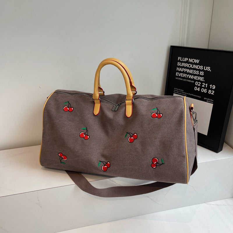 Sporty weekend bag with playful cherry pattern Bowlift