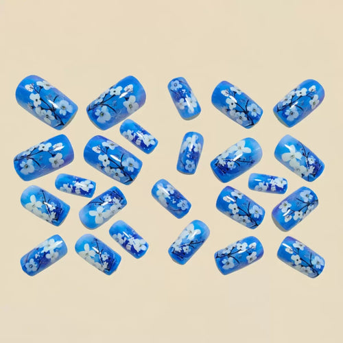 Artificial nail set with floral designs and glitter accents Bowlift