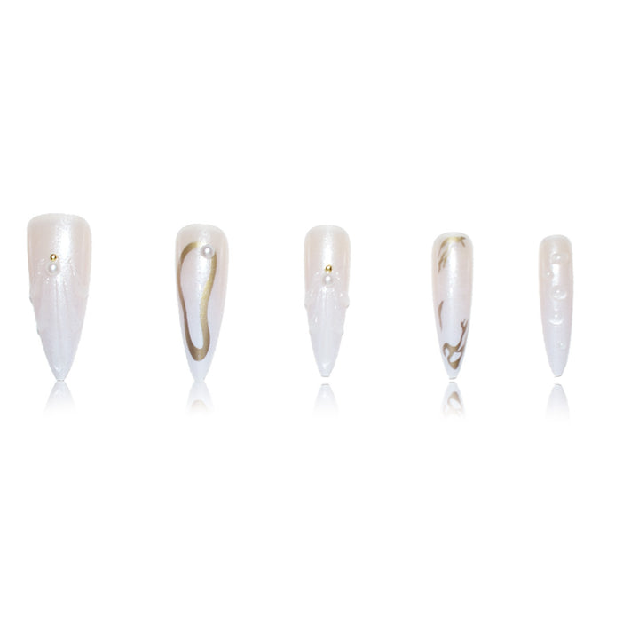 Artistic Press-On Nail Designs with Pearl Accents Bowlift