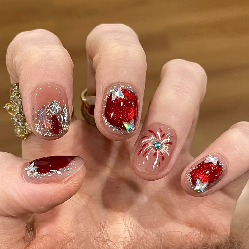 Artificial nail set with festive gift design and elegant glitter accents Bowlift