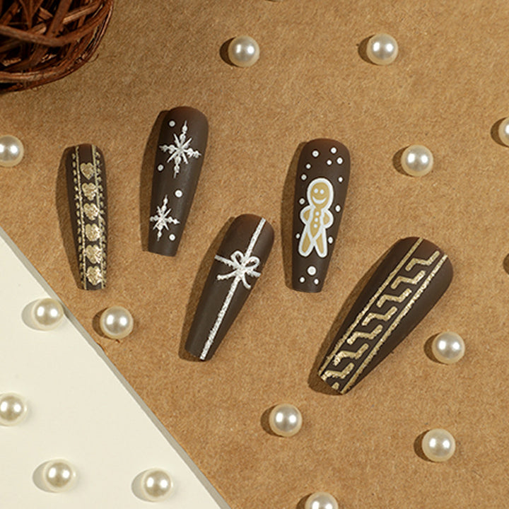 Artificial nail art with festive gingerbread design Bowlift