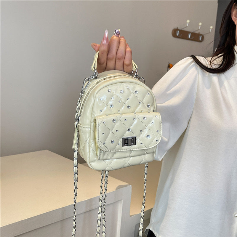 Quilted Mini Backpack with Rhinestone Accents Bowlift