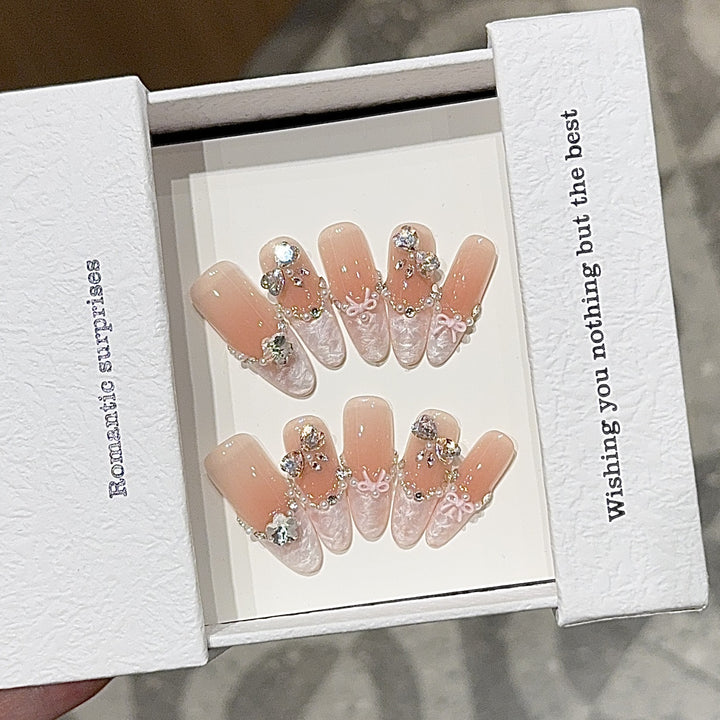 Artificial nails with romantic rhinestone details Bowlift