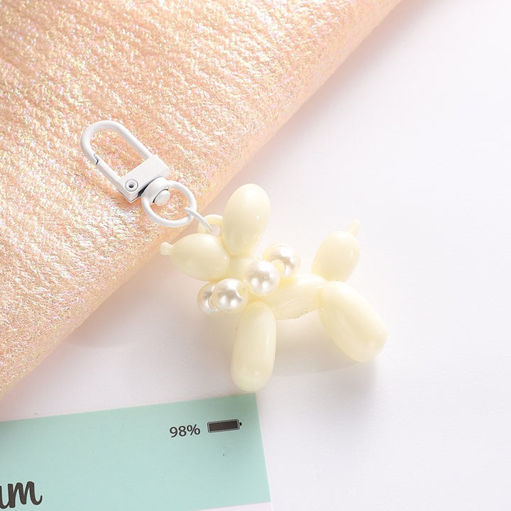 Playful keychain with balloon dog and beads Bowlift