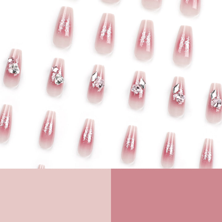 Glamorous artificial nails with glitter and crystal embellishment Bowlift
