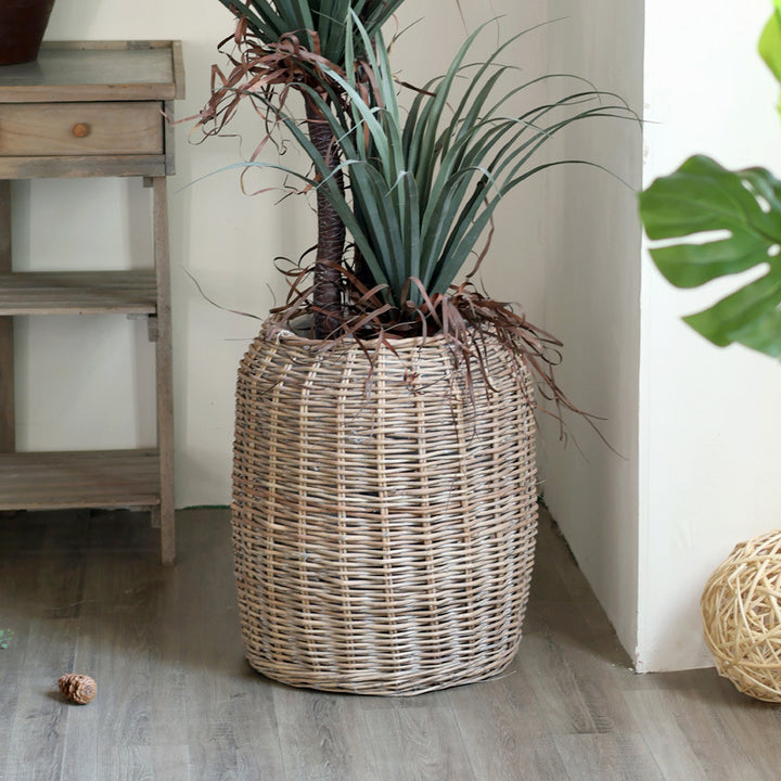 Stylish laundry basket made of braided natural material Bowlift