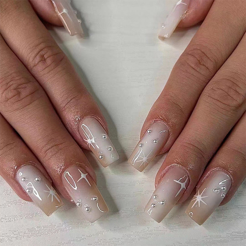 Artful Gel Nails with Elegant Floral Design and Glitter Accents Bowlift