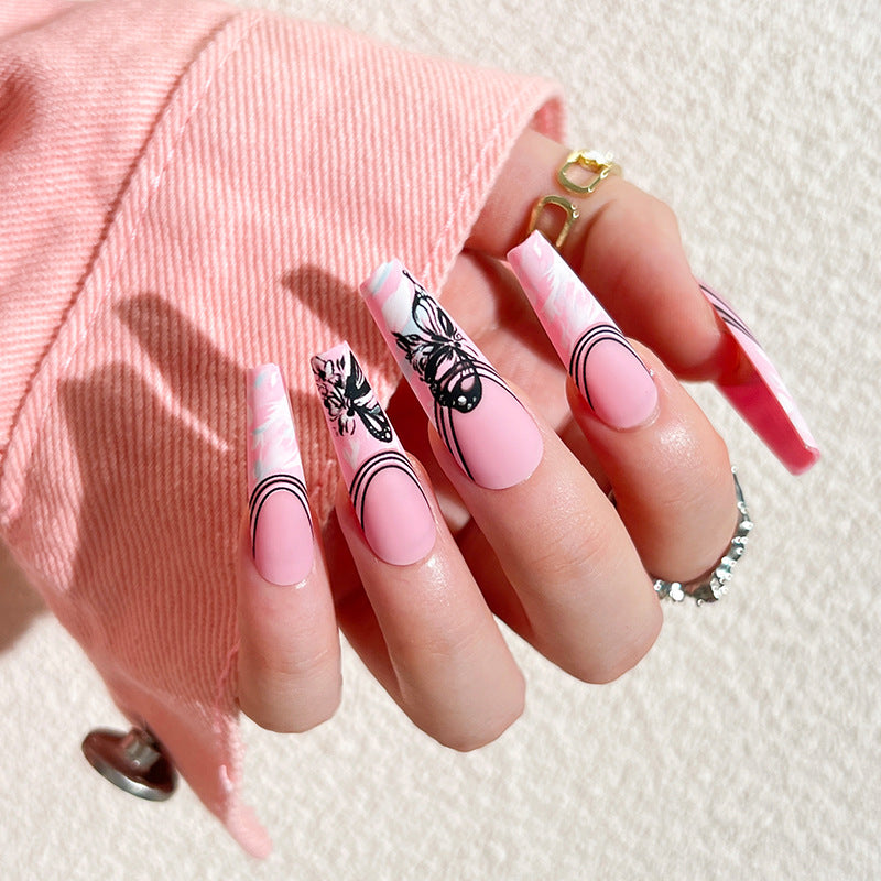 Artificial nail art with delicate butterfly designs Bowlift