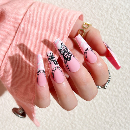 Artificial nail art with delicate butterfly designs Bowlift