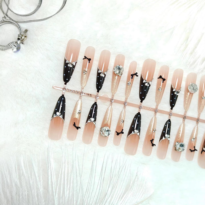 Artificial nails with glamorous rhinestone details Bowlift