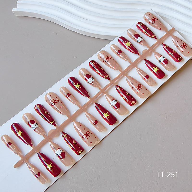 Artificial nails in festive Christmas design Bowlift