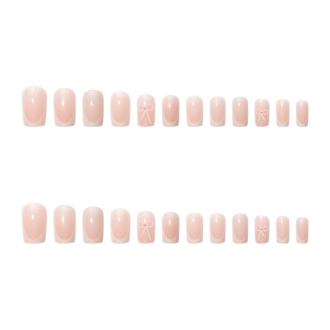 Nail art set with elegant bow and glitter accents Bowlift