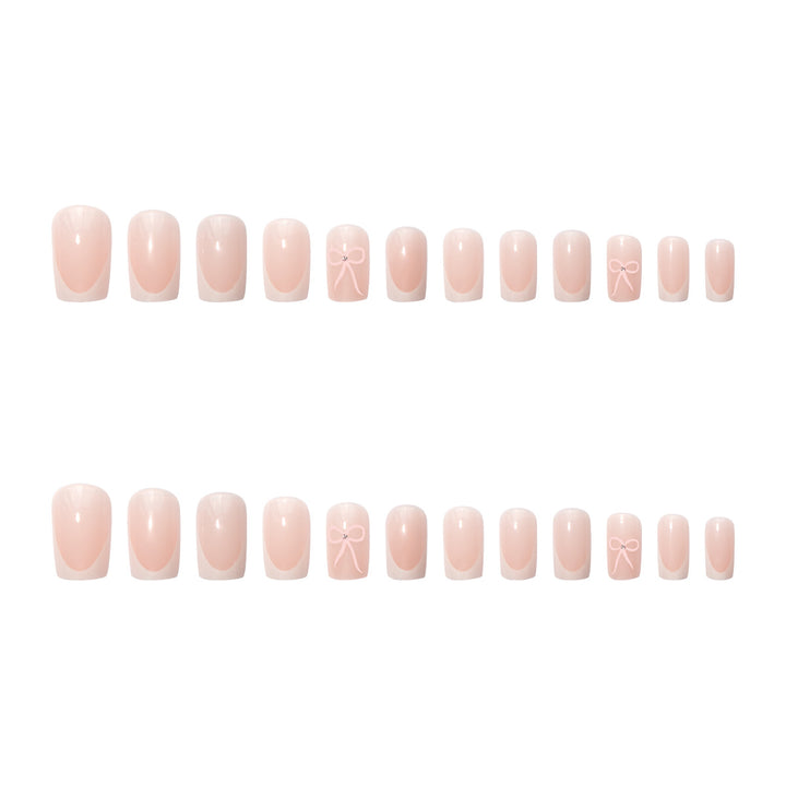 Nail art set with elegant bow and glitter accents Bowlift